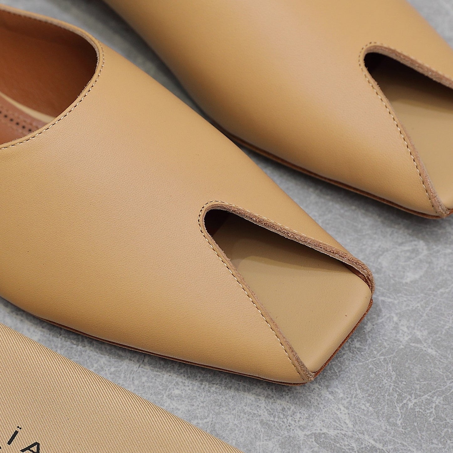 ALAIA FLAT MULE IN SEPIA TAN LAMBSKIN