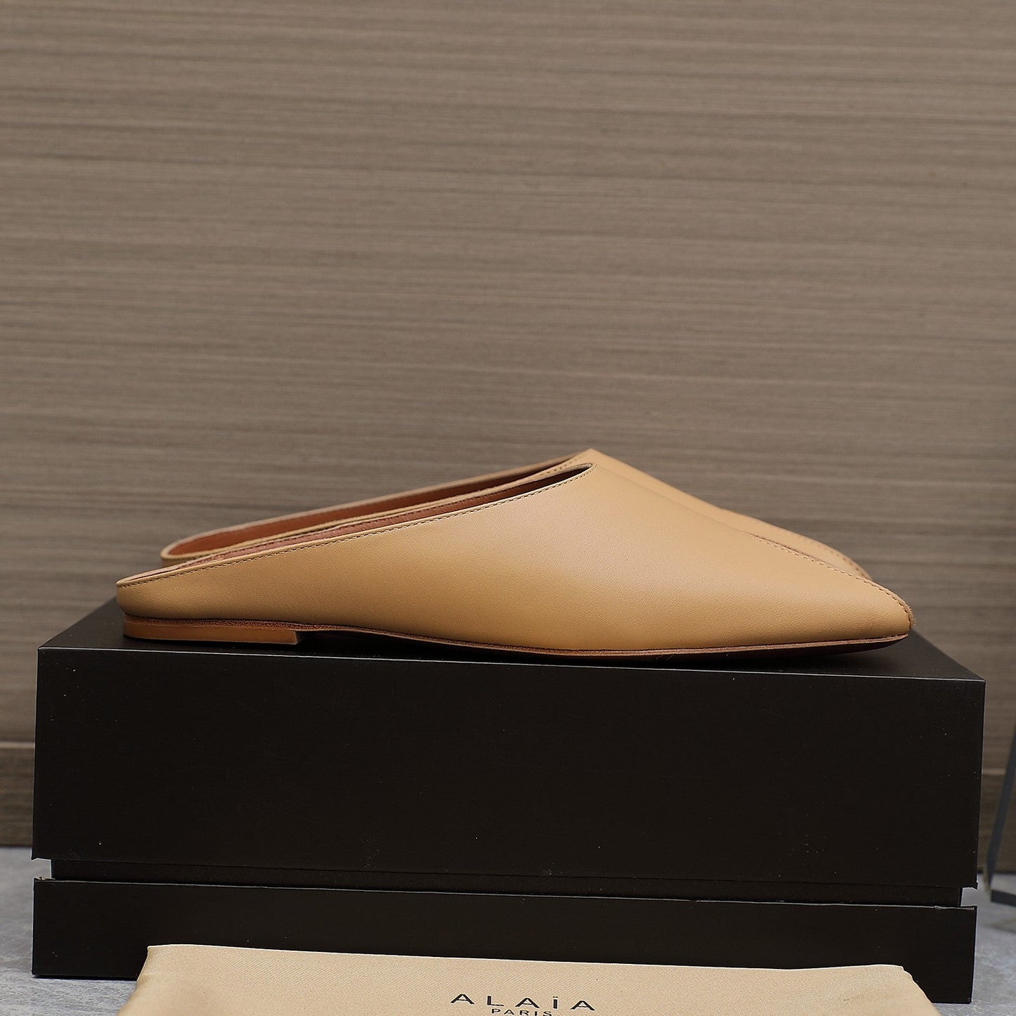 ALAIA FLAT MULE IN SEPIA TAN LAMBSKIN