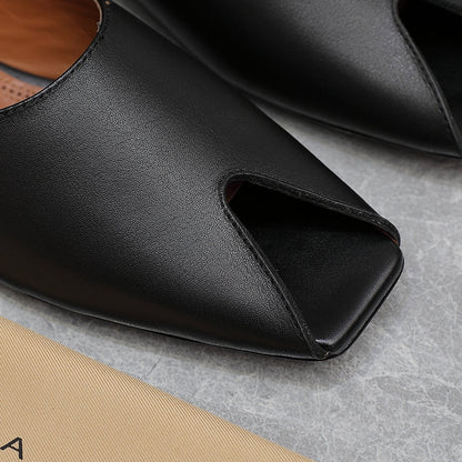 ALAIA FLAT MULE IN BLACK LAMBSKIN