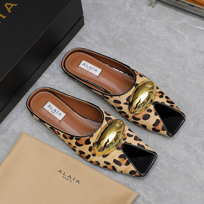 ALAIA FLAT MULE IN LEOPARD LAMBSKIN WITH GOLD HARDWARE