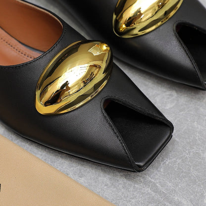 ALAIA FLAT MULE IN BLACK LAMBSKIN WITH GOLD HARDWARE