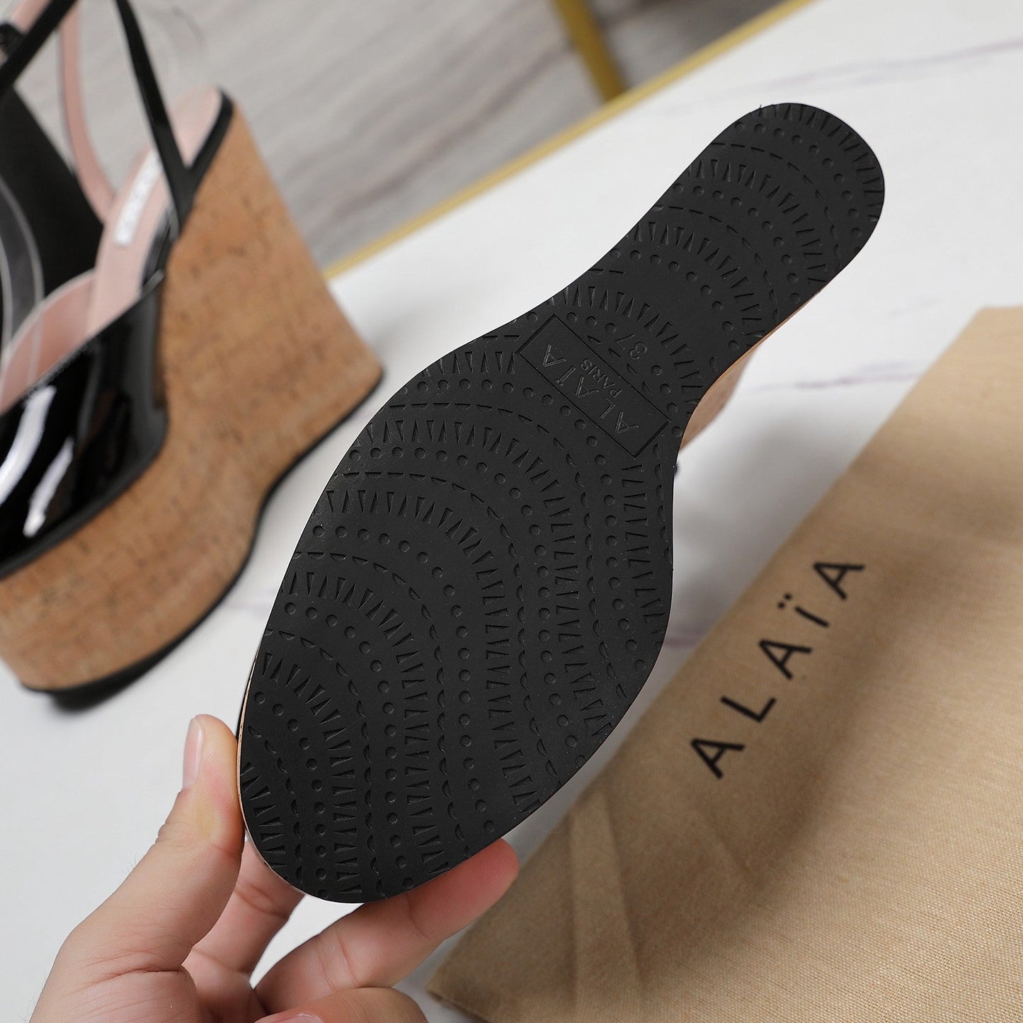 ALAIA WEDGE SANDAL IN BLACK GLOSSY CALFSKIN AND BEIGE RUBBER