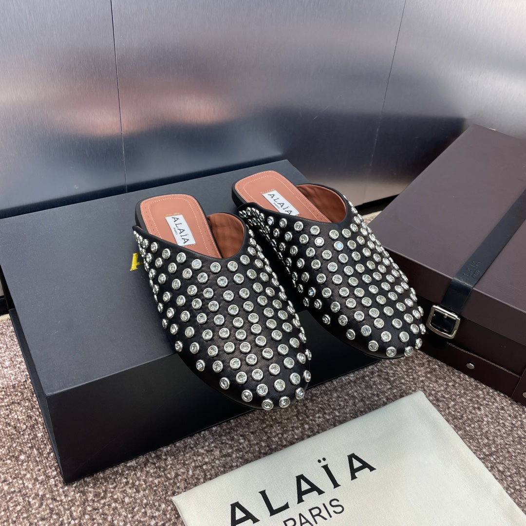 ALAIA FLAT MULES 25S IN BLACK LAMBSKIN EMBELLISHED WITH CRYSTALS