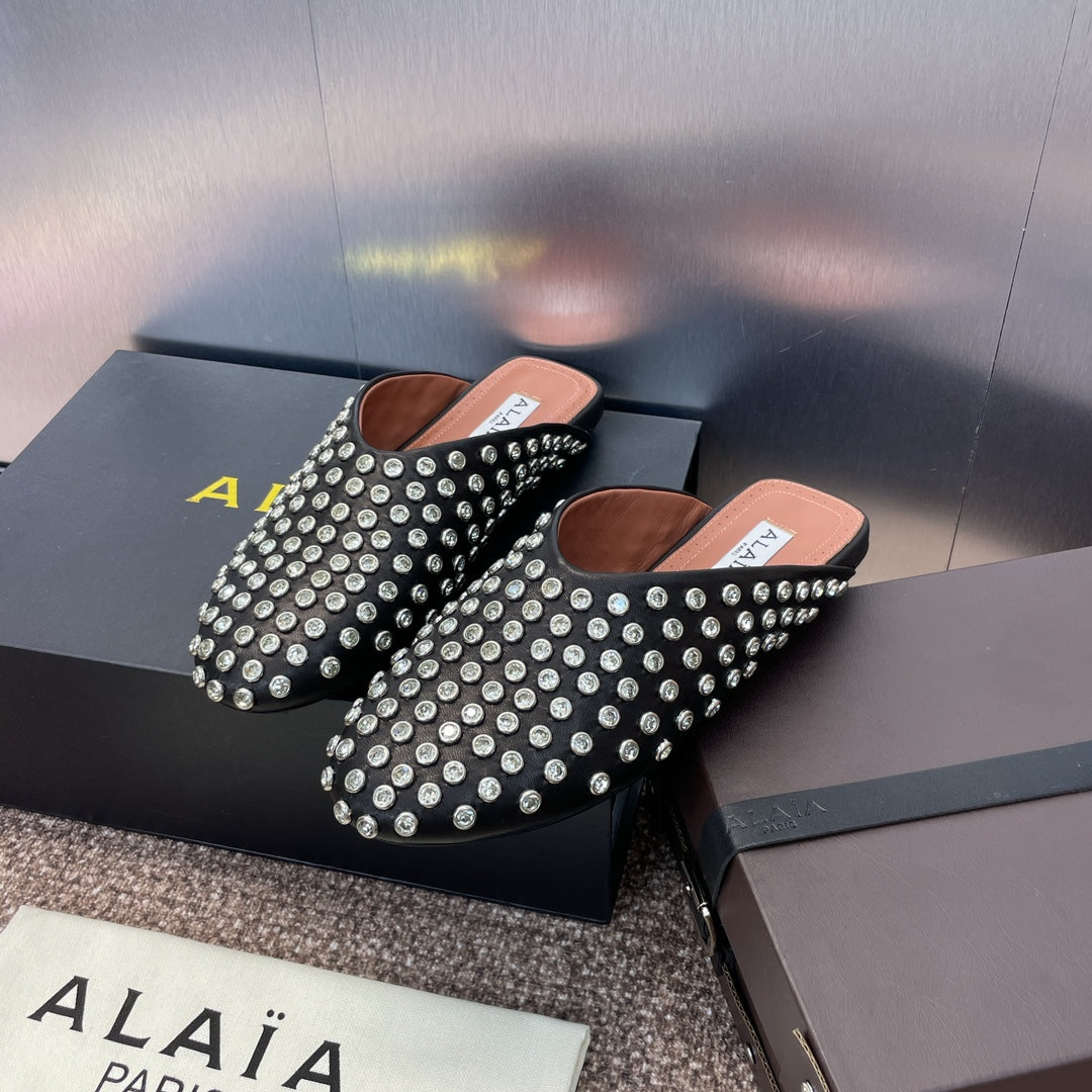 ALAIA FLAT MULES 25S IN BLACK LAMBSKIN EMBELLISHED WITH CRYSTALS