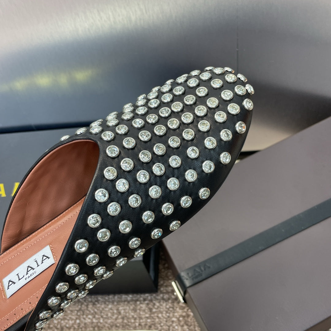 ALAIA FLAT MULES 25S IN BLACK LAMBSKIN EMBELLISHED WITH CRYSTALS
