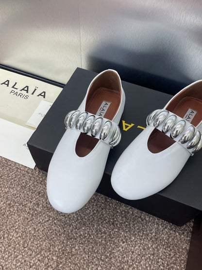 ALAIA MARY JANE FLATS 25S IN WHITE CALFSKIN WITH SILVER HARDWARE