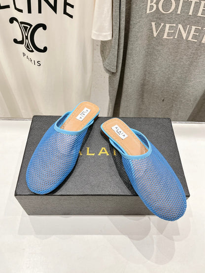 ALAIA FLAT MULES IN CERULEAN BLUE MESH FISHNET