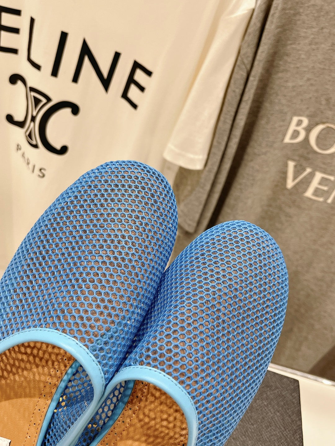 ALAIA FLAT MULES IN CERULEAN BLUE MESH FISHNET